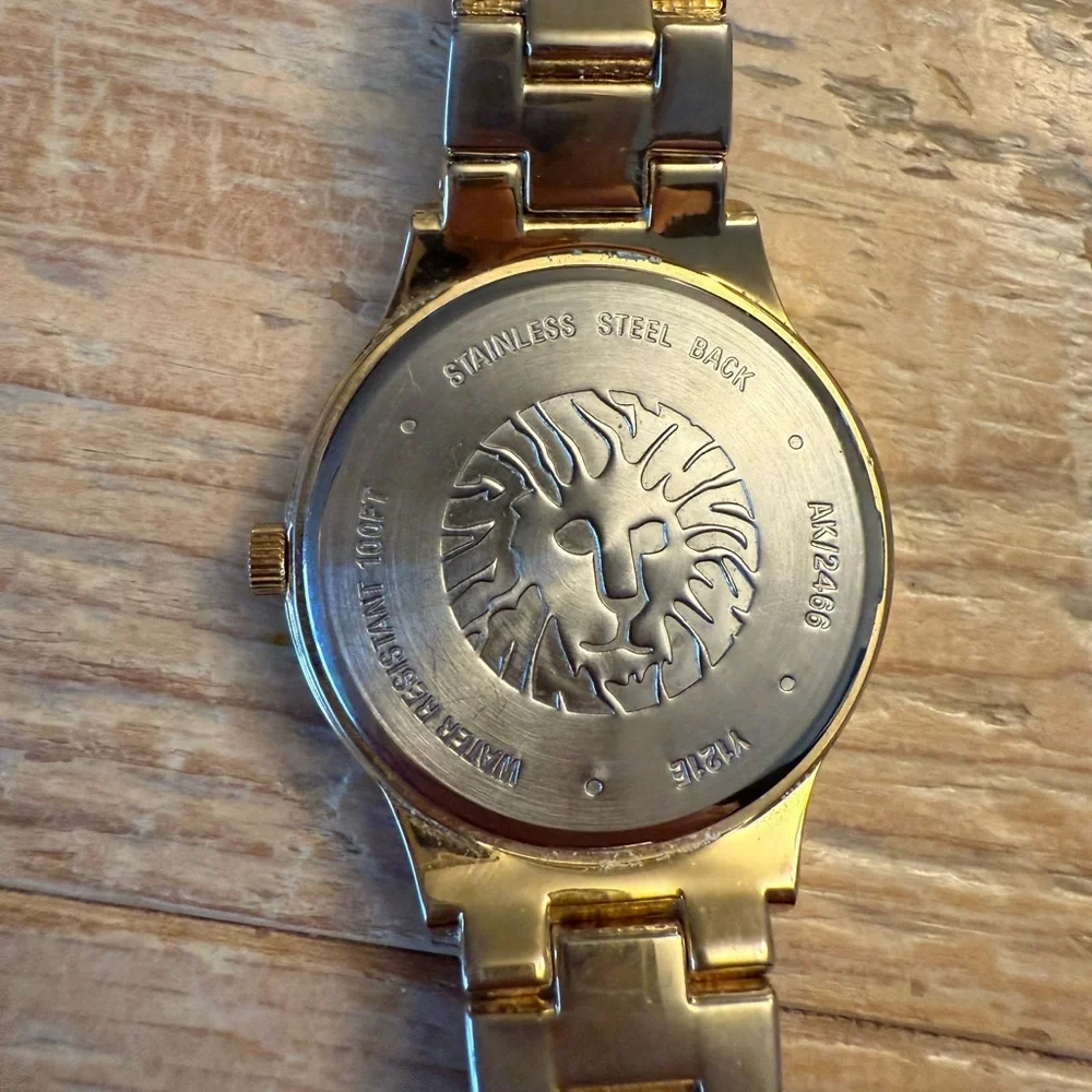 Anne Klein Gold-Tone Crystal Bezel Women's Watch with Mother-of-Pearl Dial